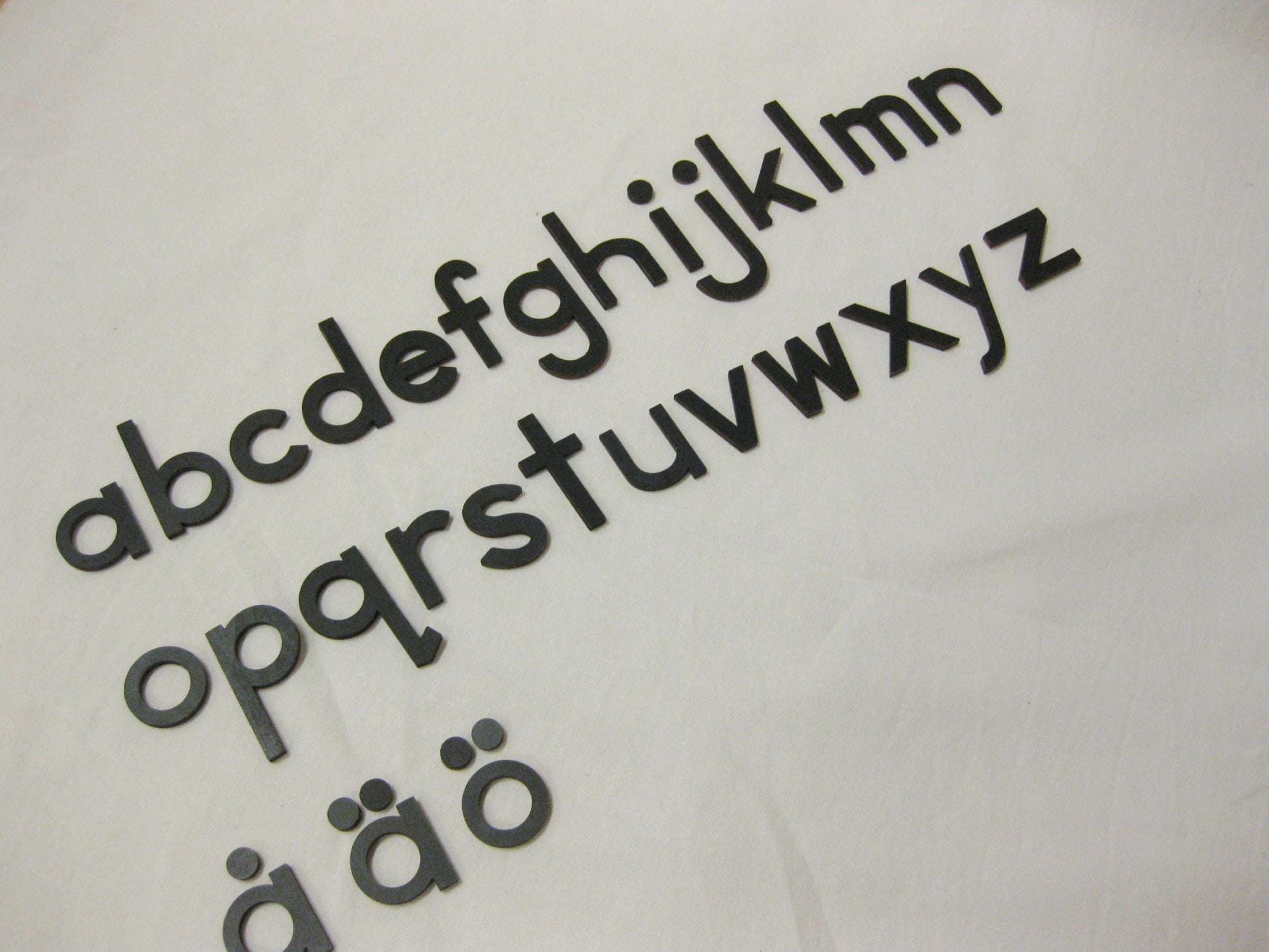 Lilla rörliga alfabetet gemener svart