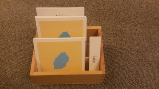 Wooden box with compartments for 3 or 4 part cards. 16 cm wide, 11 cm deep, each compartment measures 3.5 cm